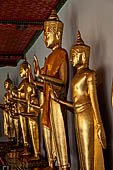 Bangkok Wat Pho, Buddha gilded statues lined in the double cloister enclosing the ubosot. 